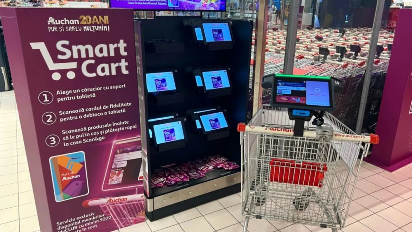 Auchan testează cărucioare inteligente în România: scanează lista scrisă de mână și calculează valoarea cumpărăturilor